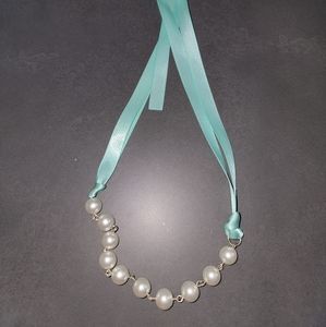 Pearl necklace with teal ribbon